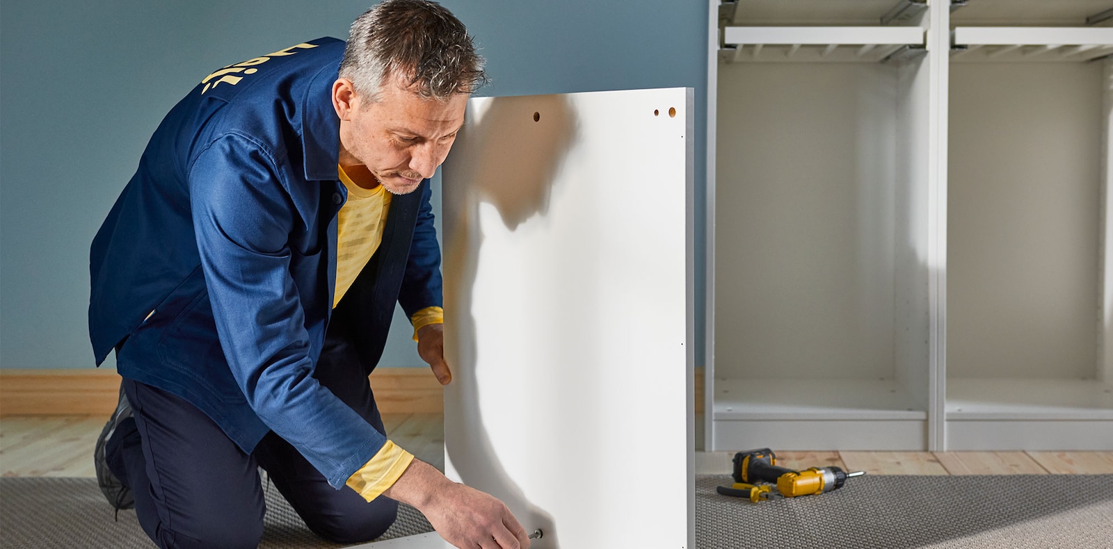 IKEA bed assembly with SKORVA midbeam – parts laid out